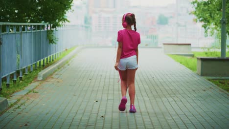 a joyful child expressing freedom and enthusiasm in a scenic park, captured from different angles, highlighting movement and playfulness against a vibrant urban backdrop