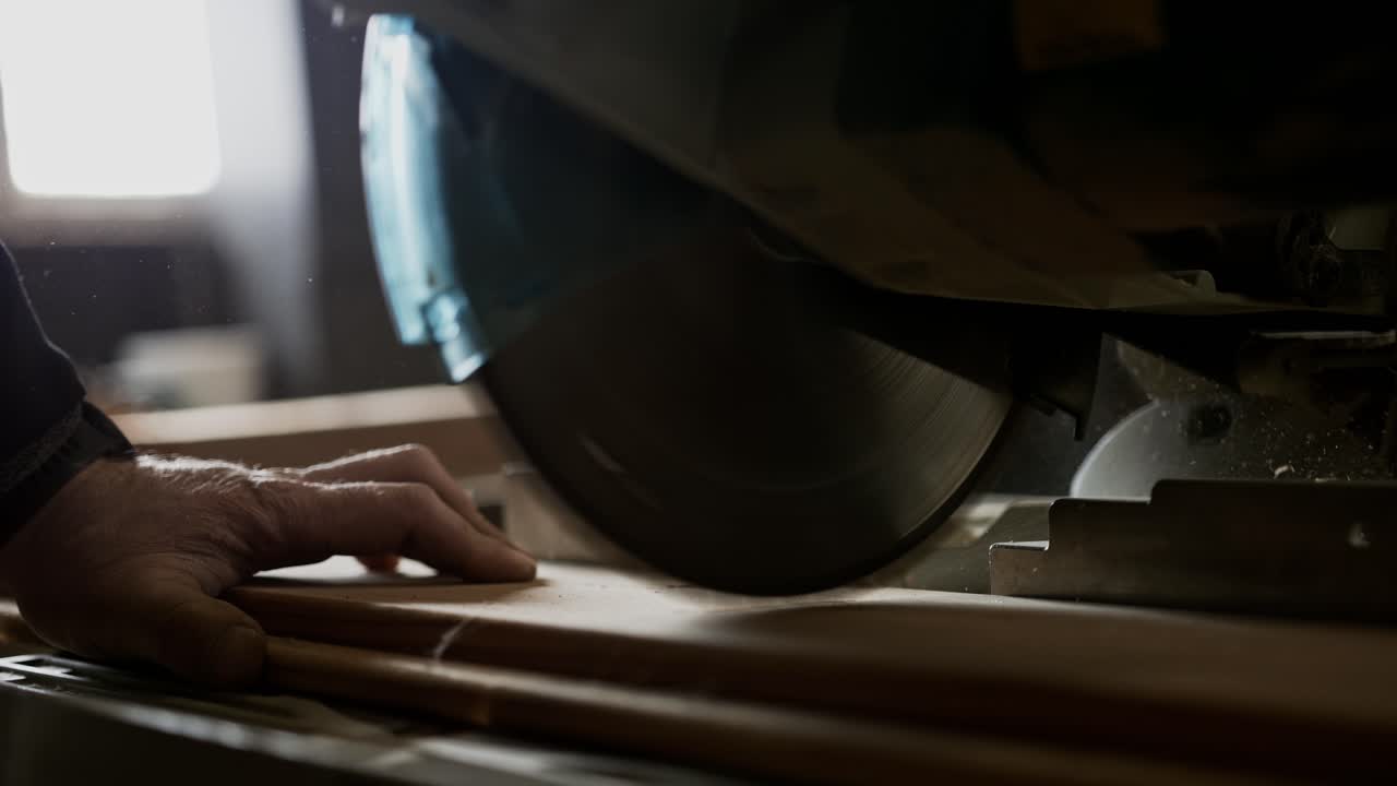 Cutting wood with a circular saw in a workshop, super slow motion, near Middelburg, NL
