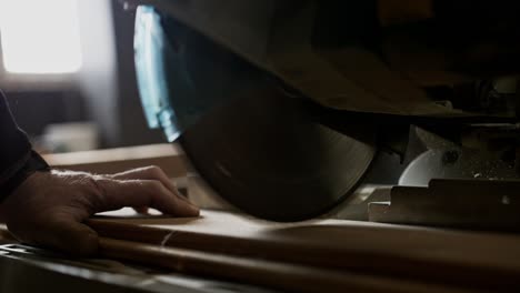 cutting wood with a circular saw in a workshop, super slow motion, near middelburg, nl