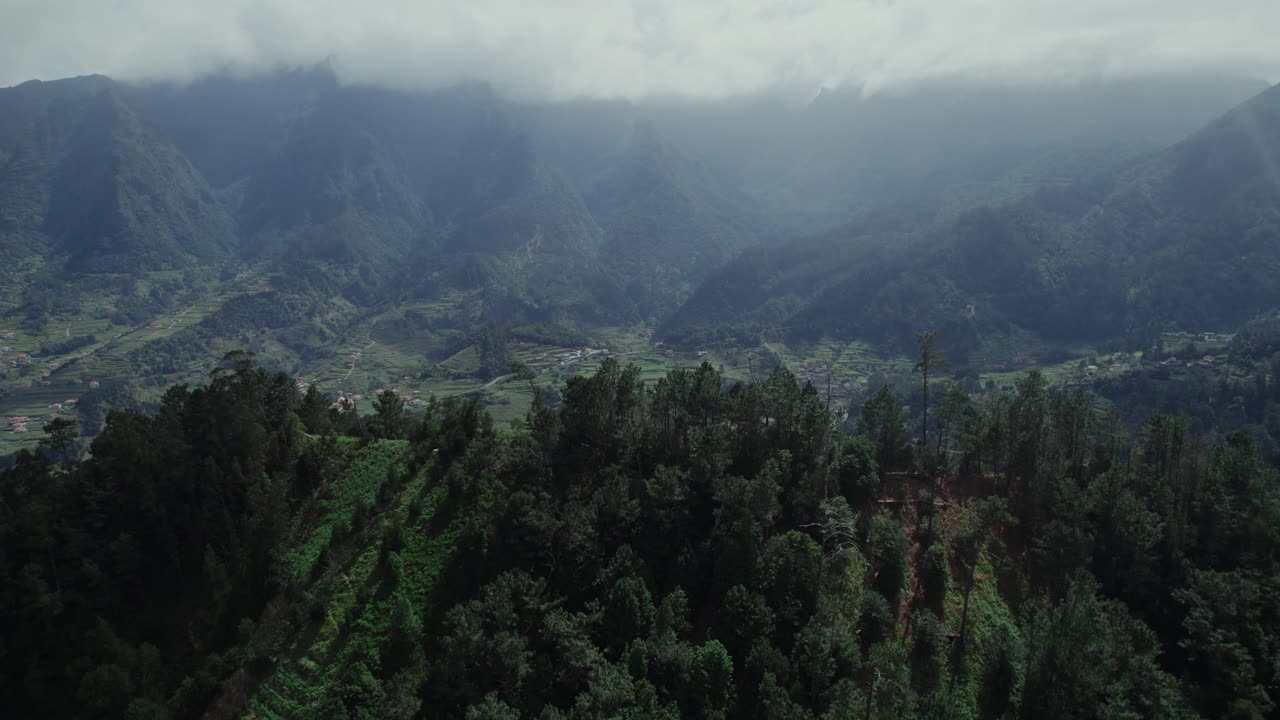 Aerial View of Lush Mountain Valley with Terraced Fields