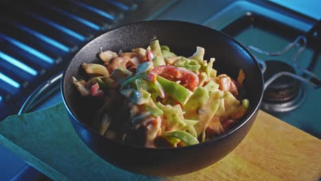 A-closeup-slowly-zooming-in-to-a-beautiful,-crisp-low-calorie-chicken-salad-in-a-serving-dish