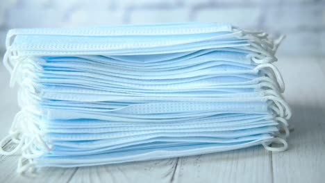 stack of blue surgical masks