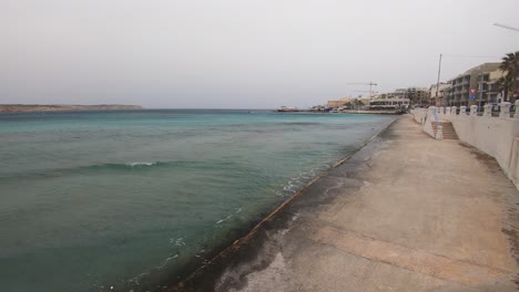 the popular tourist resort of mellieha in malta on a windy day