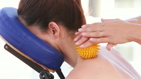 Woan-having-back-massage-with-massage-ball