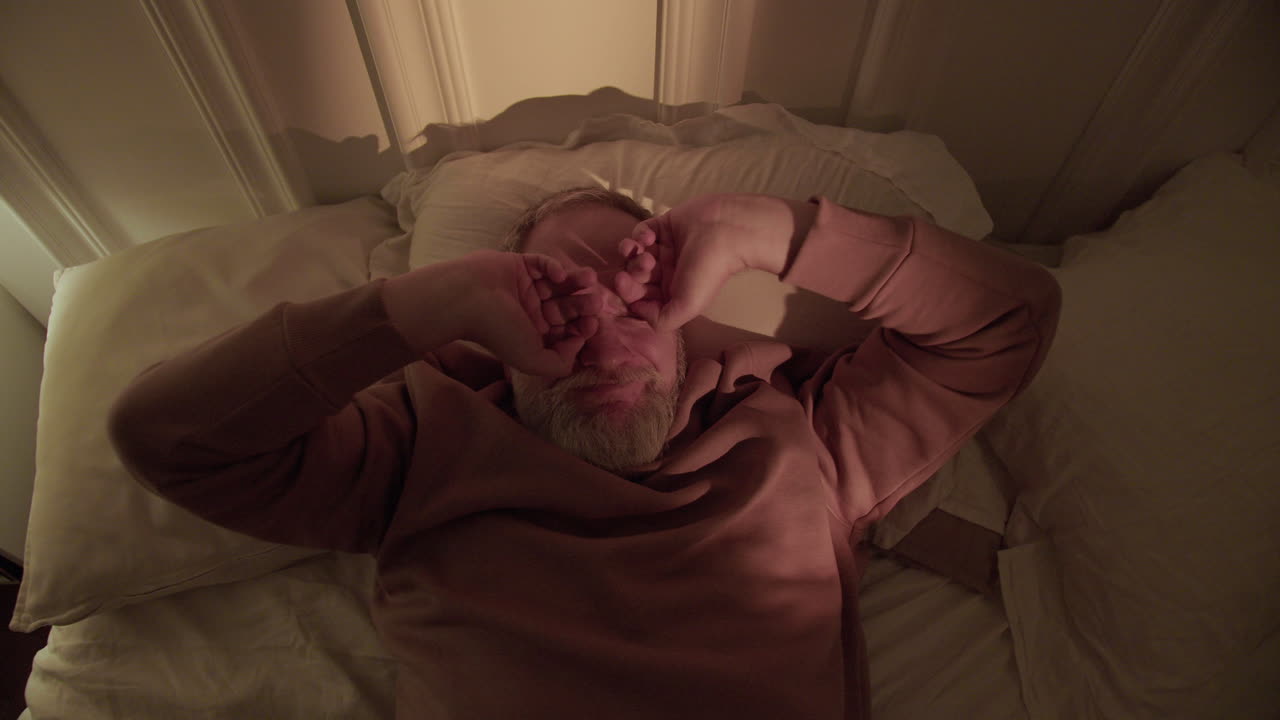 Old man trying to sleep