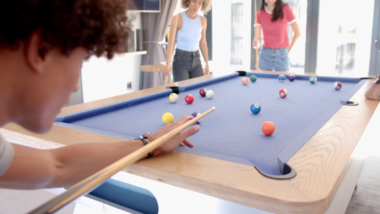 At home, Playing pool, diverse friends enjoying game together in relaxed environment