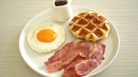 fried egg with bacon and waffle for breakfast