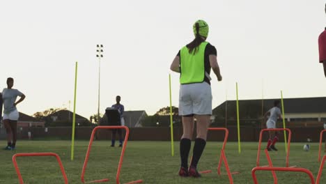 young adult female rugby team training