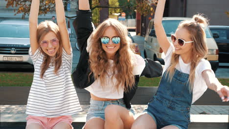 happy friends on a city bench