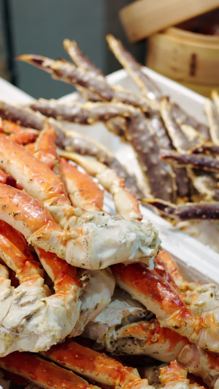 Red king crab meat on display at the Tsukiji Fish Market in Japan. Vertical