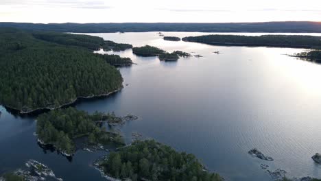 aerial shot of swedish islands, landscape with forest and big lakes, 4k