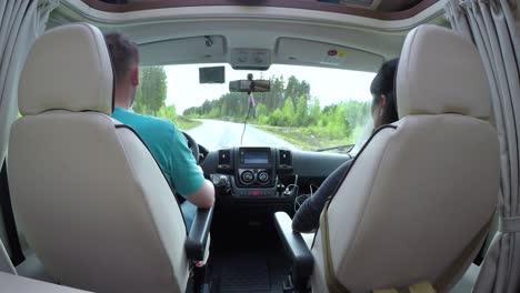 man driving on a road in the camper van rv