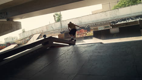 Energetic-skater-performing-trick-during-freestyle-session-at-skate-park.