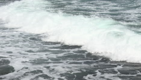 waves breaking, rolling on land, bonaire