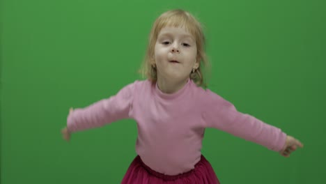 Happy-three-years-old-girl.-Cute-blonde-child.-Dancing-and-make-faces