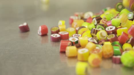Colorful-caramel-fruit-candy-falling-and-bouncing-in-slow-motion