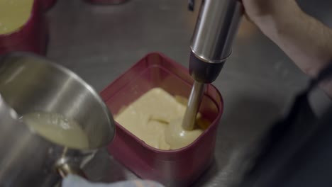mixing ingredients with a handheld mixer