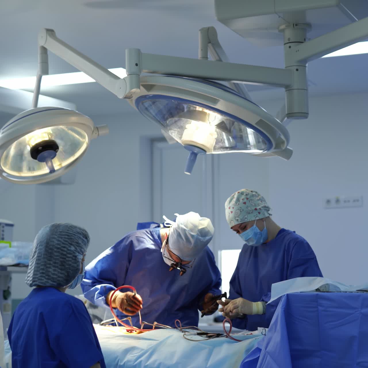 Group of neurosurgeons working in emergency ward. Neurosurgery in modern hospital