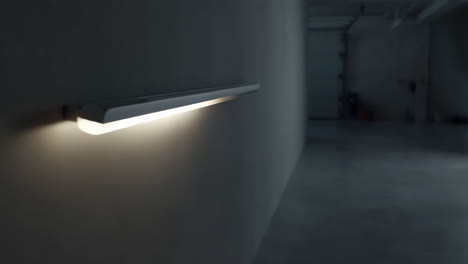 sleek led wall light illuminating a dim interior space