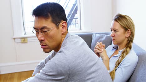 Man-and-woman-upset-with-each-other-in-living-room