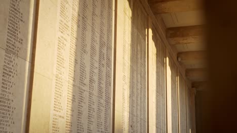 names of fallen soldiers at a war memorial cemetery in ypres belgium, handheld drifting shot