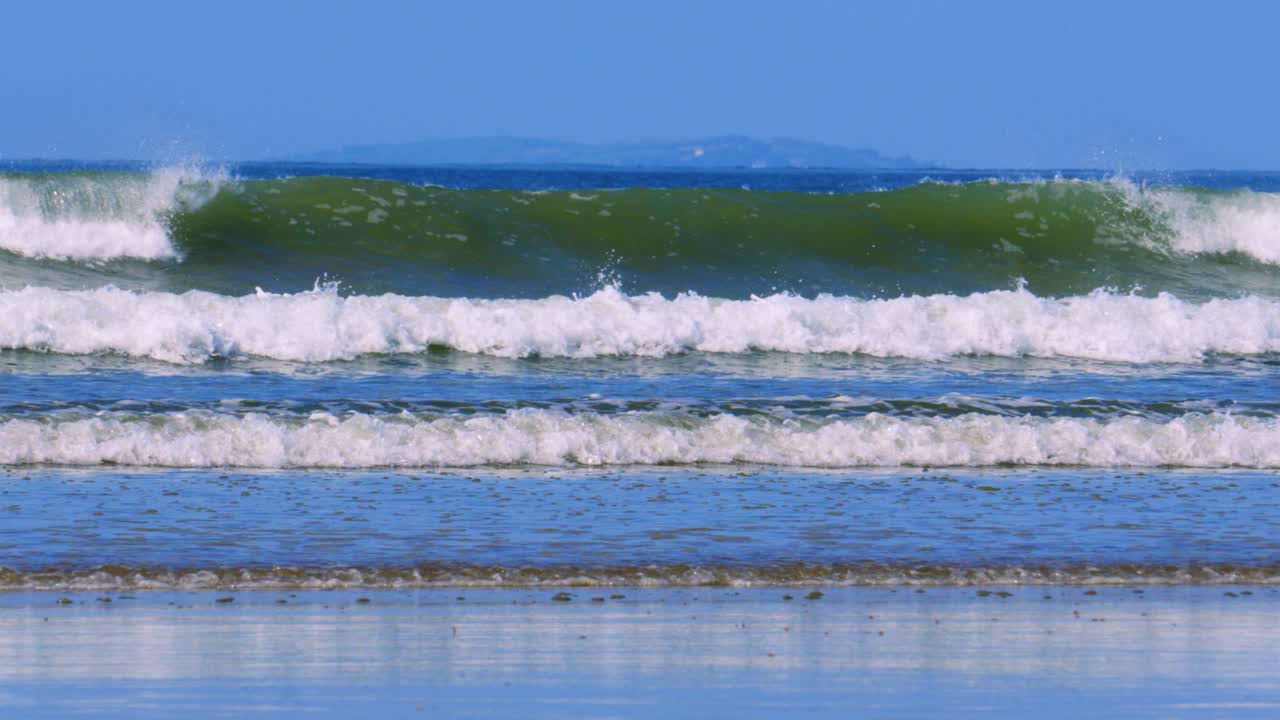 Ocean Waves Crashing on Sandy Beach