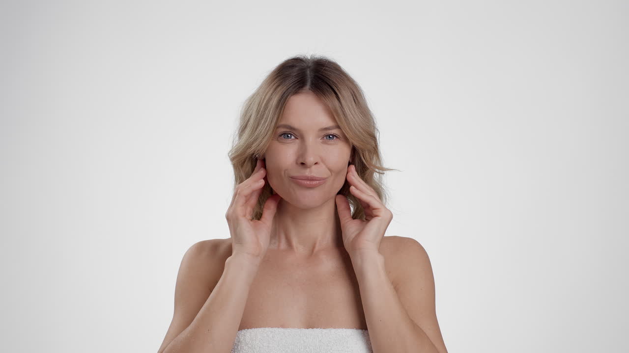 Woman Performing Facial Skincare Routine