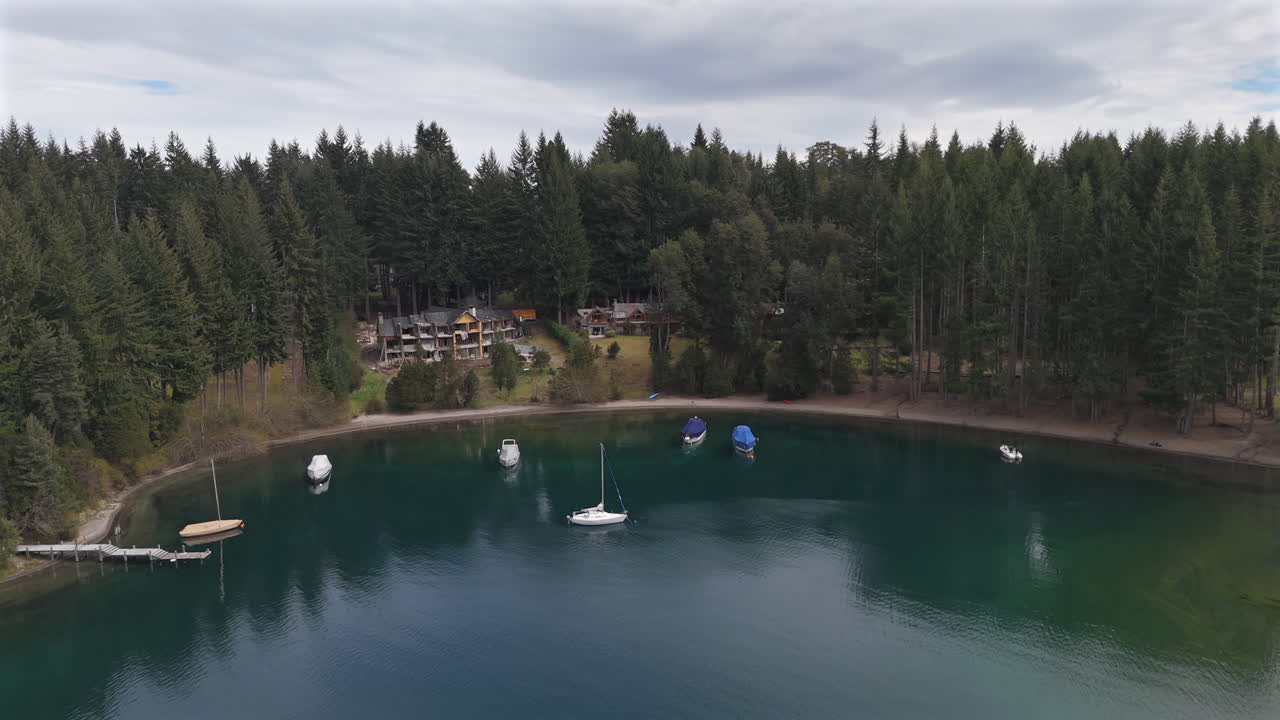 Panoramic drone movement before the El Remanso del Lago resort, Puerto Manzano, Argentina.