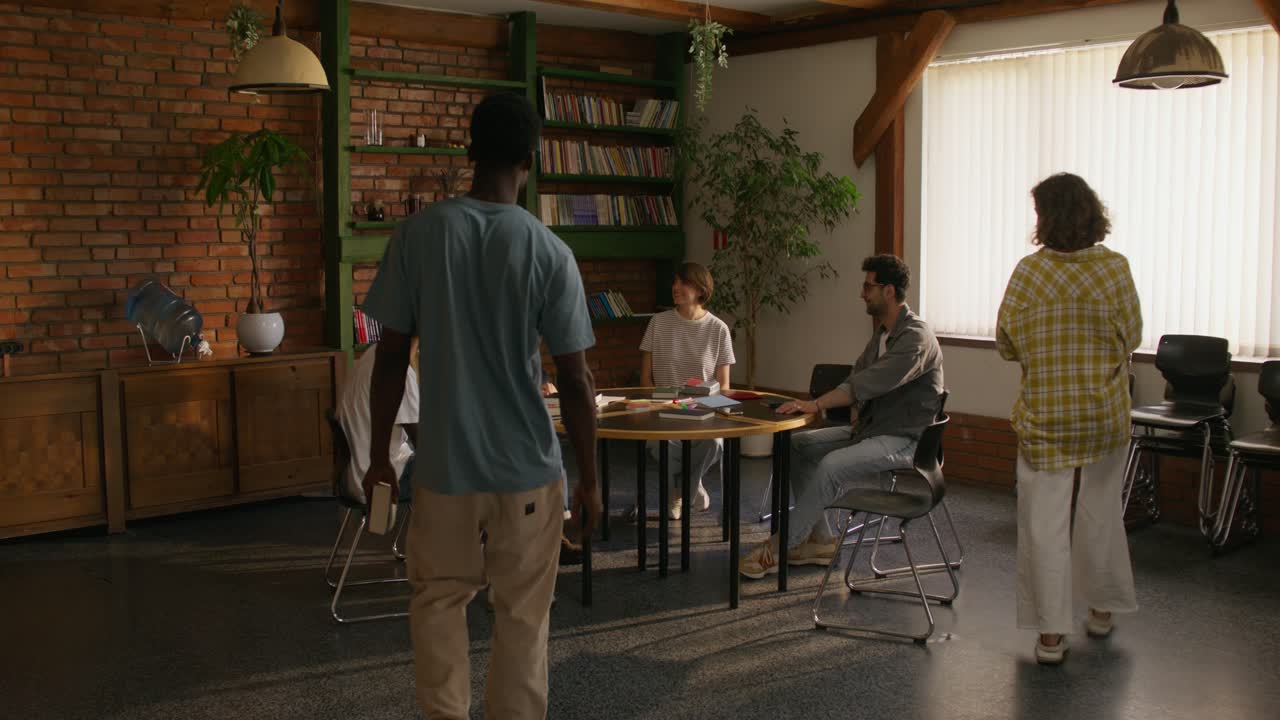 Diverse Group Meeting in a Study Space