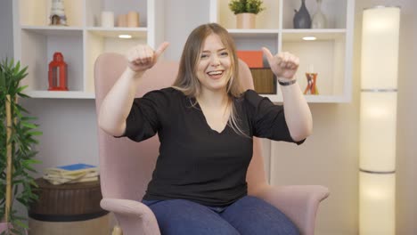 Young-woman-giving-greeting-and-applause-to-camera.