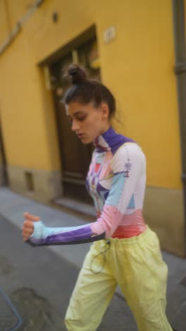 stylish woman in trendy printed bodysuit in an urban setting