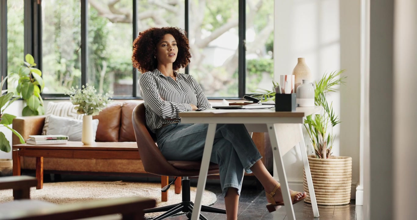 Young Woman Closing Laptop and Taking a Break in Home Office