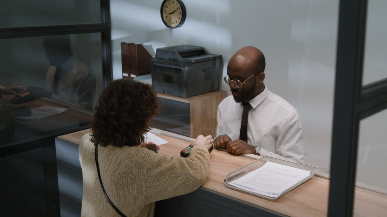 Customer making a payment at the counter.