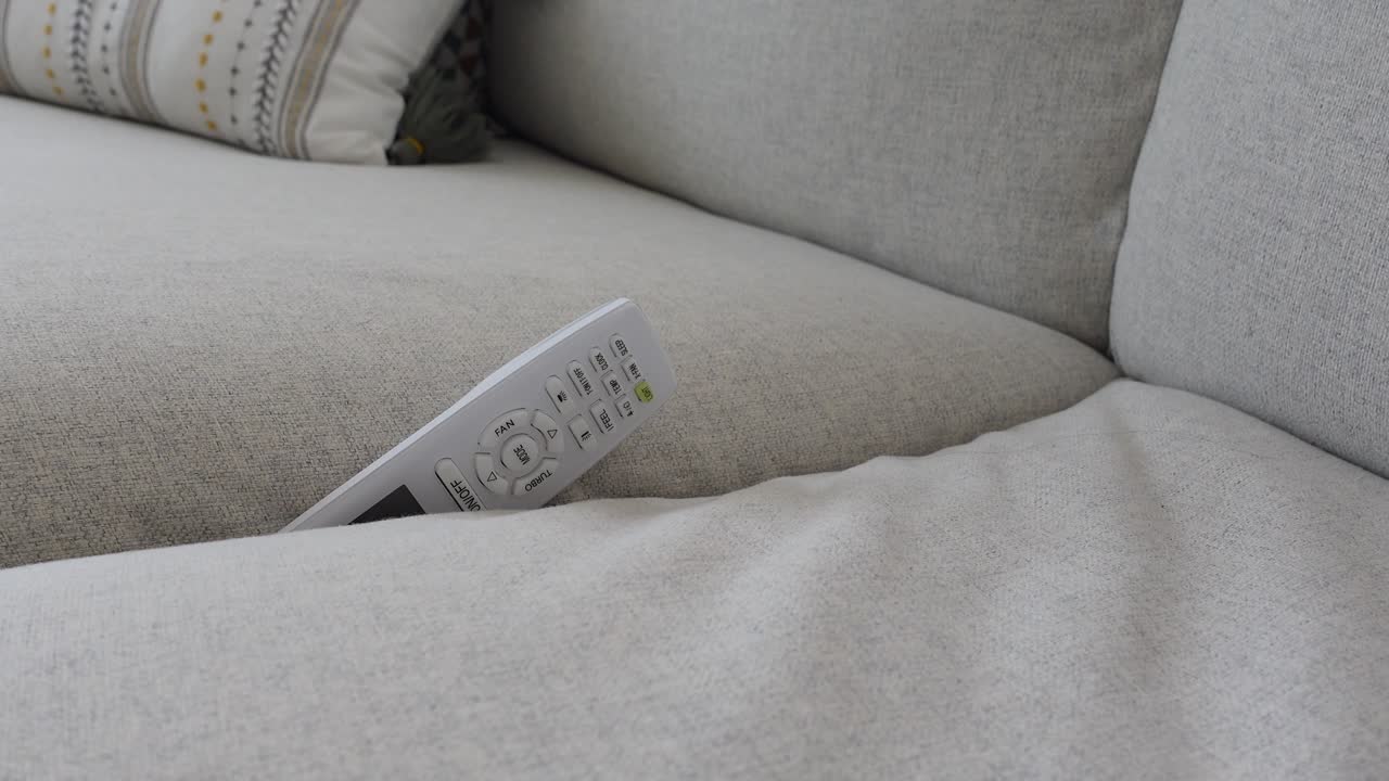 A remote control on a sofa