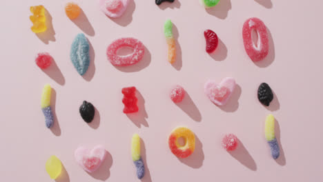 video of colourful jelly candy on pink background