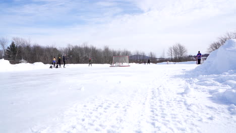 People-playing-outdoor-ice-hockey