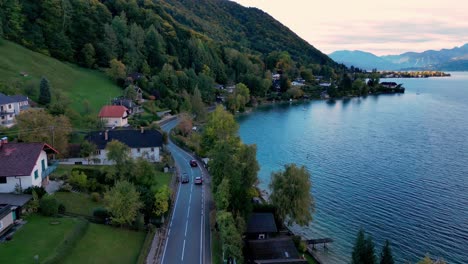 A-peaceful-drive-along-a-scenic-lake-surrounded-by-lush-greenery