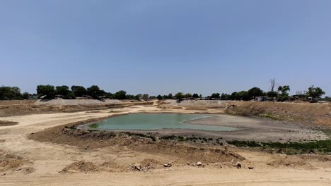 Steady-wide-view-of-city-lake-being-developed-to-add-scenic-walkway-around