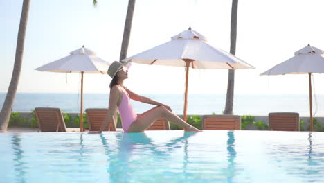 Sexy-Exotic-Woman-at-Poolside-on-Tropical-Travel-Destination-Enjoying-on-Summer-Sun,-Full-Frame