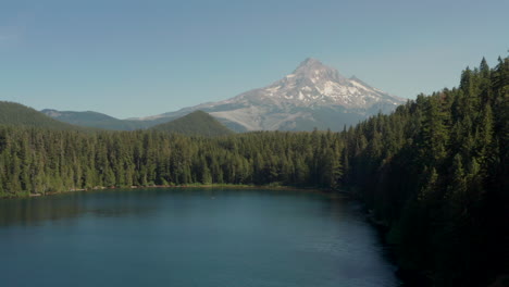 rising aerial shot of mount hood over lost lake