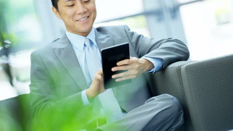 portrait young asian american businessman in city office