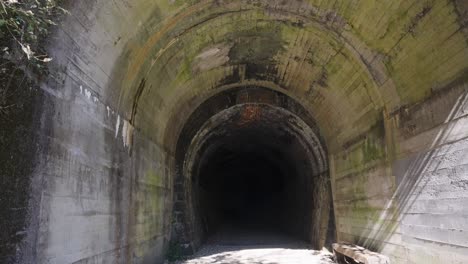 grunge tunnel interior along takedao abandoned railway hike, japan