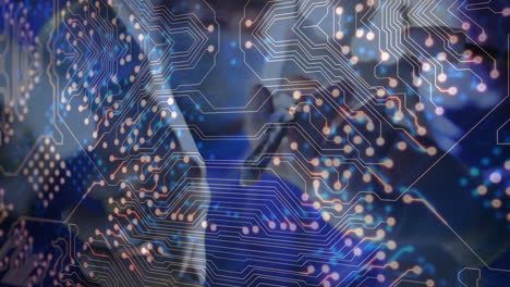 animation of circuit board pattern overlaying blue and black background with lights