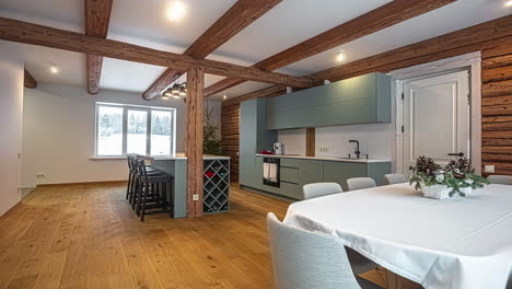 looking from the living room to the open-concept kitchen of a rustic, modern home