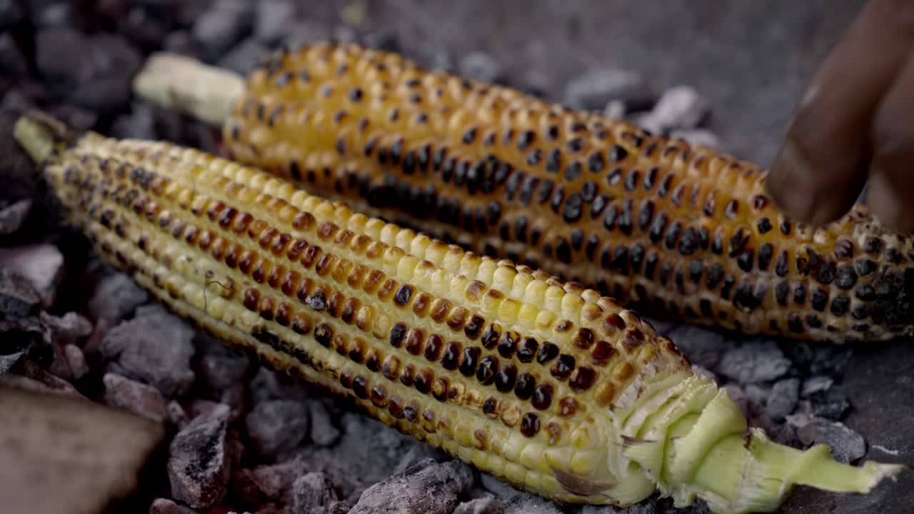 Sweet corn Grill , sweet corn cooking on charcoal, ripe corn cobs grilled sweetcorn for food vegan dinner or snack, street food in India