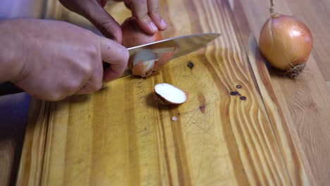 slicing onion chopping into julienne on wooden board kitchen healthy healthy diet