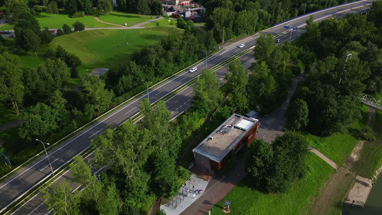 City traffic bypass development divides green leisure landscape AERIAL VIEW