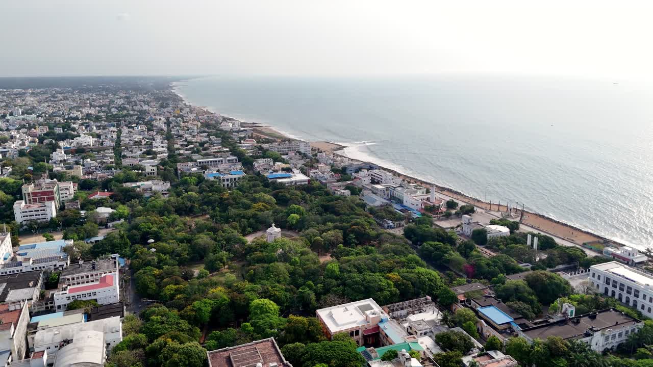 Aerial view of Bharathi Park, Puducherry, near Mahatma Gandhi statue shoreline featuring a dramatic Bay of Bengal vista. Pondicherry City was its previous name