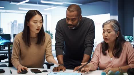 diverse team discussing data in modern office