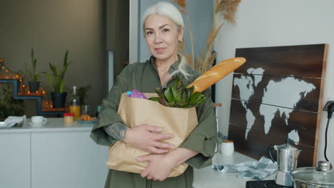 senior woman with grocery bag
